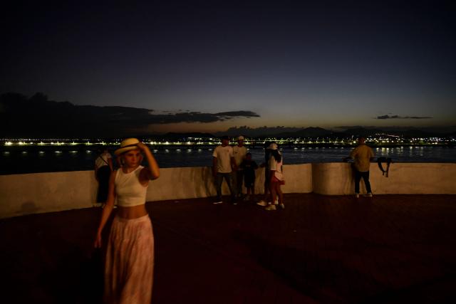 Tourists walk at the France Square in Panama City's old town on December 26, 2025. (Photo by MARTIN BERNETTI / AFP)