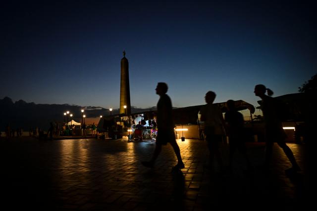 Tourists walk at the France Square in Panama City's old town on December 26, 2025. (Photo by MARTIN BERNETTI / AFP)