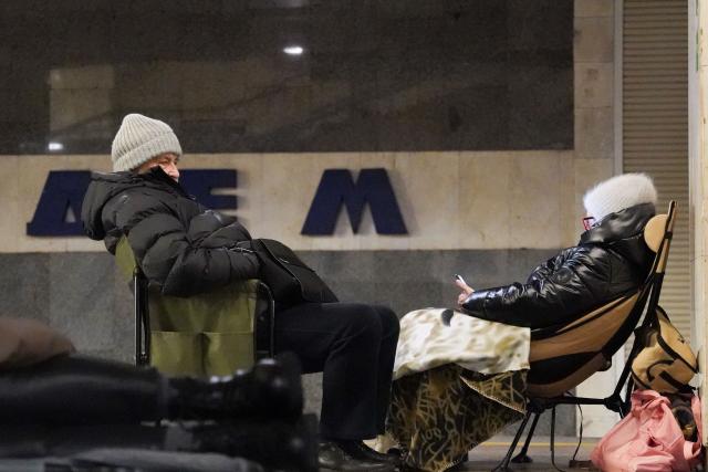 People take shelter at a metro station during Russian air attacks in Kyiv on December 27, 2025, amid the Russian invasion of Ukraine. Ukraine's air force announced a countrywide air alert and said drones and missiles were moving over several regions including Kyiv. (Photo by Serhii Okunev / AFP)