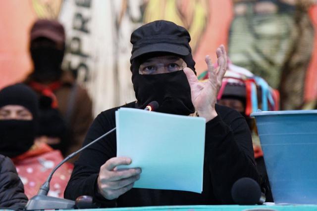 Former Subcommander, now Captain Marcos of the Zapatista Army of National Liberation (EZLN in Spanish), delivers a welcoming message to the meeting called “Of Pyramids, of Histories, of Loves and Heartbreaks” in the framework of the 32nd anniversary of his armed uprising in 1994, in the city of San Cristobal de las Casas, state of Chiapas, Mexico, on December 26, 2025. (Photo by Isaac GUZMAN / AFP)