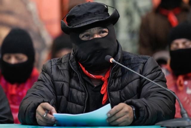 Subcommander Moises, of the Zapatista Army of National Liberation (EZLN in Spanish), speaks during the meeting called “Of Pyramids, of Histories, of Loves and Heartbreaks” in the framework of the 32nd anniversary of his armed uprising in 1994, in the city of San Cristobal de las Casas, state of Chiapas, Mexico, on December 26, 2025. (Photo by Isaac GUZMAN / AFP)