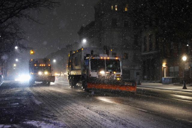Snowplows clear snow on December 26, 2025 in New York. New York, the US largest city, was bracing for up to 10 inches (25 centimeters) of snow overnight, the most in four years. (Photo by ANGELA WEISS / AFP)