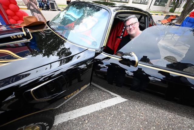 Charge d'Affaires at the US Embassy in Kuwait Steven Butler tours the Cars and Coffee Celebration of America exhibition held at the US Embassy in Kuwait City on December 27, 2025. The exhibition showcased a number of classic and modern American vehicles. (Photo by YASSER AL-ZAYYAT / AFP)