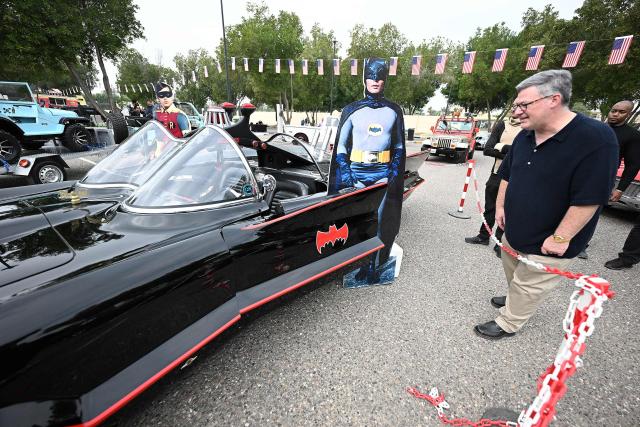 Charge d'Affaires at the US Embassy in Kuwait Steven Butler tours the Cars and Coffee Celebration of America exhibition held at the US Embassy in Kuwait City on December 27, 2025. The exhibition showcased a number of classic and modern American vehicles. (Photo by YASSER AL-ZAYYAT / AFP)