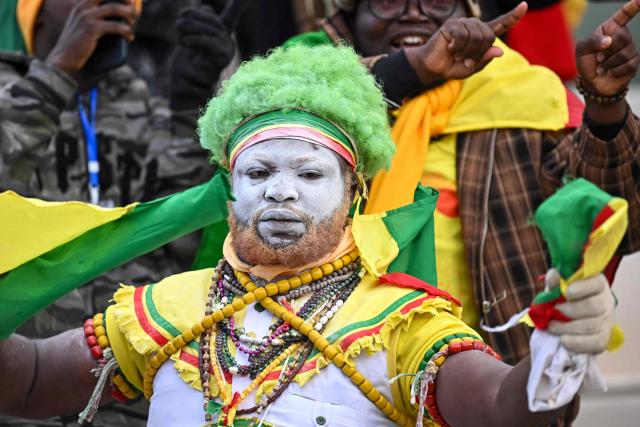 A supporter of Benin cheers prior the Africa Cup of Nations (CAN) Group D football match between Benin and Botswana at Rabat Olympic Stadium in Rabat on December 27, 2025. (Photo by Paul ELLIS / AFP)