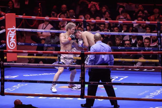 Japan's boxer Naoya Inoue (L) fights Mexico's boxer David Picasso in the "The Ring V night of Samurai" final major fight card of the year at the Mohammed Abdo Arena in Riyadh on December 27, 2025. (Photo by Fayez NURELDINE / AFP)