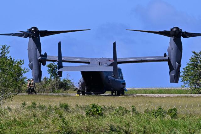US military MQ-9 Reaper drones sit on a tarmac at Rafael Hernandez Airport in Aguadilla, Puerto Rico, on December 27, 2025. The United States has deployed a major military force in the Caribbean and has recently intercepted oil tankers as part of a naval blockade against Venezuelan vessels it considers to be under sanctions. Since September, US forces have launched dozens of air strikes on boats that Washington alleges, without showing evidence, were transporting drugs. More than 100 people have been killed. (Photo by Miguel J. Rodriguez Carrillo / AFP)