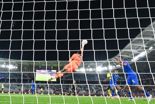 Tanzania's goalkeeper #28 Zuberi Foba makes a save during the Africa Cup of Nations (CAN) Group C football match between Uganda and Tanzania at Al Medina Stadium in Rabat on December 27, 2025. (Photo by SEBASTIEN BOZON / AFP)