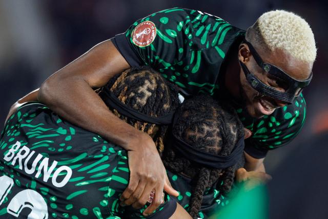 Nigeria's forward #09 Victor Osimhen celebrates the third goal of his team during the Africa Cup of Nations (CAN) Group C football match between Nigeria and Tunisia at Fez Stadium in Fez on December 27, 2025. (Photo by Abdel Majid BZIOUAT / AFP)