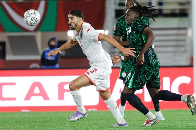 Tunisia's forward #09 Hazem Mastouri vies with Nigeria's forward #11 Samuel Chukwueze during the Africa Cup of Nations (CAN) Group C football match between Nigeria and Tunisia at Fez Stadium in Fez on December 27, 2025. (Photo by Abdel Majid BZIOUAT / AFP)