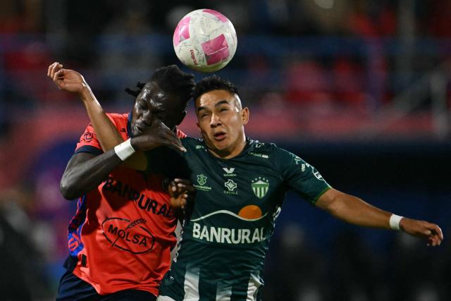 Municipal's Guyanese defender #52 Aubrey David and Antigua´s midfielder #18 Oscar Santis fight for the ball during the Guatemalan Apertura tournament final second-leg football match between Municipal and Antigua at El Trebol Stadium in Guatemala City on December 27, 2025. (Photo by JOHAN ORDONEZ / AFP)