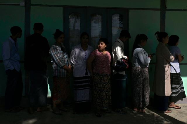 TOPSHOT - People line up to vote at a polling station during the first phase of Myanmar's general election in Naypyidaw on December 28, 2025. (Photo by Sai Aung MAIN / AFP)