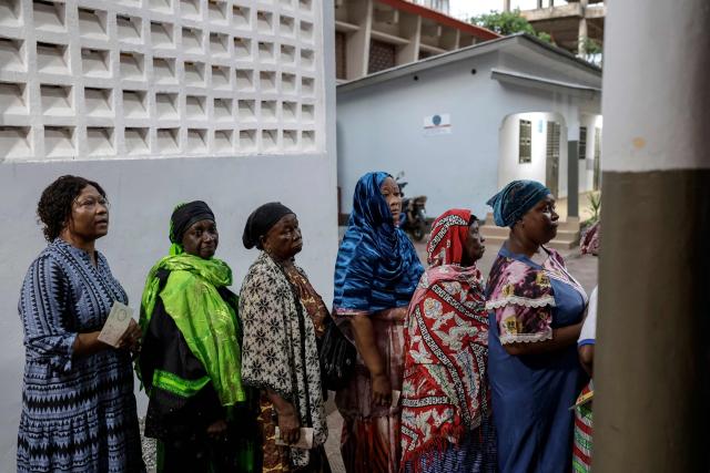 Voters queue at a polling station in Conakry on December 28, 2025 during Guinea's presidential election. (Photo by Patrick MEINHARDT / AFP)