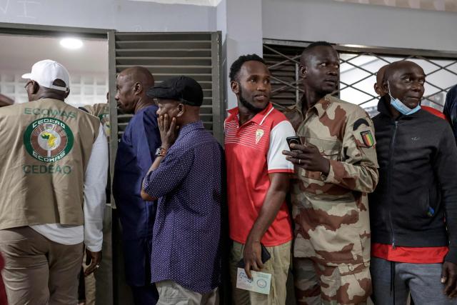 Voters queue at a polling station in Conakry on December 28, 2025 during Guinea's presidential election. (Photo by Patrick MEINHARDT / AFP)