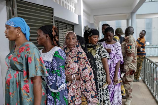 Voters queue at a polling station in Conakry on December 28, 2025 during Guinea's presidential election. (Photo by Patrick MEINHARDT / AFP)