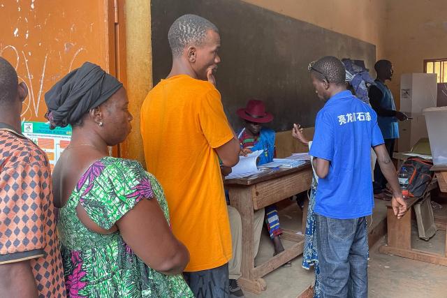 Voters queue at a polling station in Bangui on December 28, 2025 during Central African Republic's presidential election. (Photo by Annela NIAMOLO / AFP)