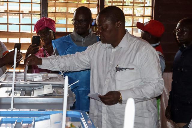 Central African Republic's President and presidential candidate for the United Hearts Movement (MCU) Faustin Archange Touadera casts his ballot at a polling station in Bangui on December 28, 2025 during Central African Republic's presidential election. (Photo by Annela NIAMOLO / AFP)