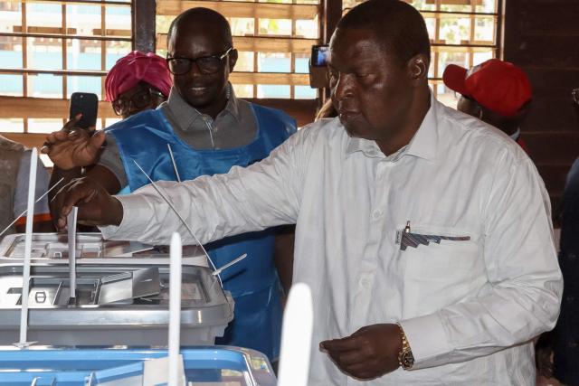 Central African Republic's President and presidential candidate for the United Hearts Movement (MCU) Faustin Archange Touadera casts his ballot at a polling station in Bangui on December 28, 2025 during Central African Republic's presidential election. (Photo by Annela NIAMOLO / AFP)