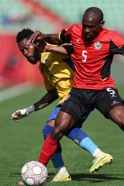 Gabon's midfielder #12 Guelor Kanga and Mozambique's defender #05 Bruno Langa vie during the Africa Cup of Nations (CAN) Group F football match between Gabon and Mozambique at Grand Stadium in Agadir on December 28, 2025. (Photo by FRANCK FIFE / AFP)