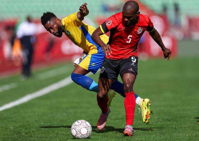 Gabon's midfielder #12 Guelor Kanga and Mozambique's defender #05 Bruno Langa vie during the Africa Cup of Nations (CAN) Group F football match between Gabon and Mozambique at Grand Stadium in Agadir on December 28, 2025. (Photo by FRANCK FIFE / AFP)
