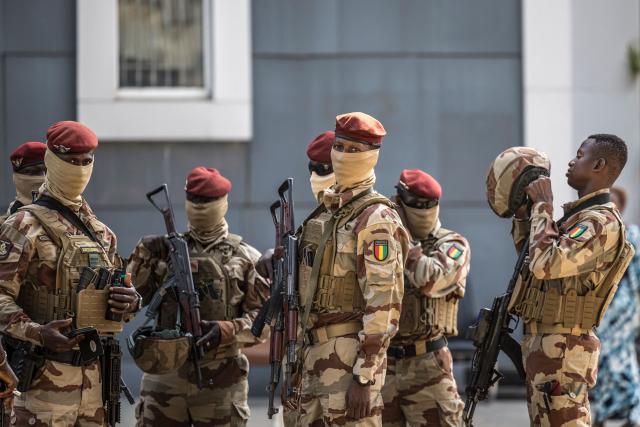 Members of the Guinea Special Forces unit deploy ahead of the arrival of Guinea President and presidential candidate Mamady Doumbouya at a polling station in Conakry on December 28, 2025 during Guinea's presidential election. (Photo by PATRICK MEINHARDT / AFP)
