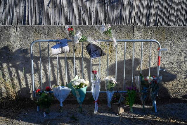 Portrais of late French actress Brigitte Bardot and flowers are displayed on barriers at the entrance of "La Madrague" house, property of late Brigitte Bardot in Saint-Tropez, southeastern France on December 28, 2025. French film legend Brigitte Bardot died at 91 AFP learnt from Bardot foundation on December 28, 2025. (Photo by Frederic DIDES / AFP)