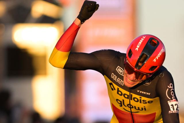 Baloise Glowi Lions Team's Belgian rider Thibau Nys celebrates as he crosses the finish line to win the men's elite race of the cyclo-cross World Cup, stage 8 out of 12 of the UCI World Cup competition, in Dendermonde on December 28, 2025. (Photo by DAVID PINTENS / BELGA / AFP)