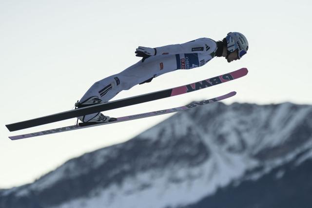 Japan's Naoki Nakamura soars through the air during the training for the Men's Individual Large Hill HS137 event of the FIS Ski Jumping World Cup, the first leg of the Four Hills Tournament, in Oberstdorf, southern Germany on December 28, 2025. (Photo by Philipp Guelland / AFP)