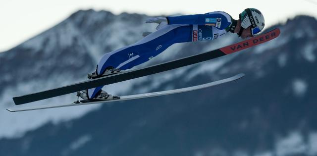 Slovenia's Timi Zajc soars through the air during the training for the Men's Individual Large Hill HS137 event of the FIS Ski Jumping World Cup, the first leg of the Four Hills Tournament, in Oberstdorf, southern Germany on December 28, 2025. (Photo by Philipp Guelland / AFP)