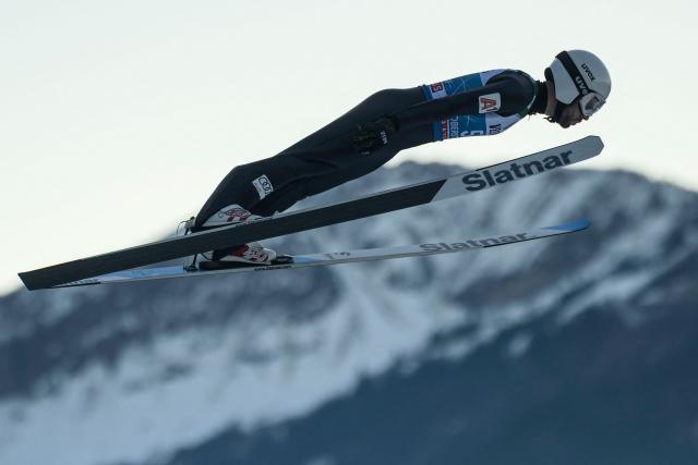 Bulgaria's Vladimir Zografski soars through the air during the training for the Men's Individual Large Hill HS137 event of the FIS Ski Jumping World Cup, the first leg of the Four Hills Tournament, in Oberstdorf, southern Germany on December 28, 2025. (Photo by Philipp Guelland / AFP)