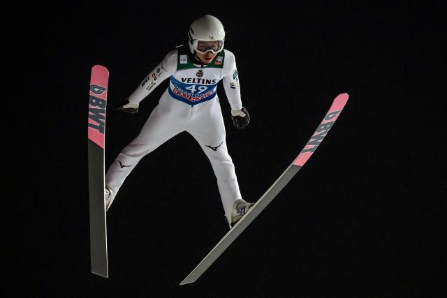 Japan's Naoki Nakamura competes during the qualifying for the Men's Individual Large Hill HS137 event of the FIS Ski Jumping World Cup, the first leg of the Four Hills Tournament, in Oberstdorf, southern Germany on December 28, 2025. (Photo by Philipp Guelland / AFP)