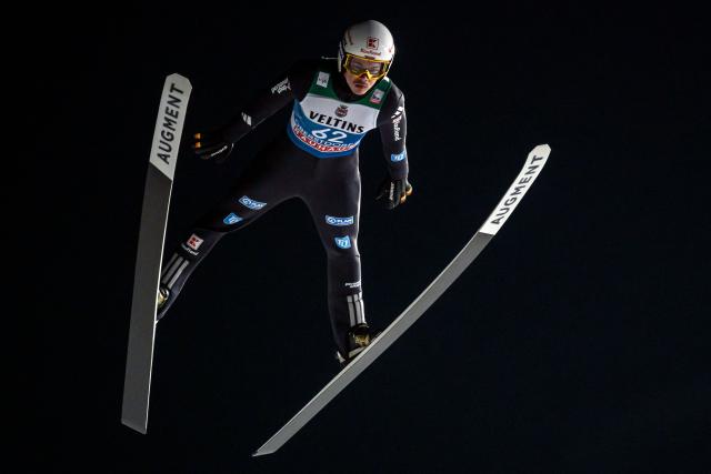 Germany's Philipp Raimund competes during the qualifying for the Men's Individual Large Hill HS137 event of the FIS Ski Jumping World Cup, the first leg of the Four Hills Tournament, in Oberstdorf, southern Germany on December 28, 2025. (Photo by Philipp Guelland / AFP)