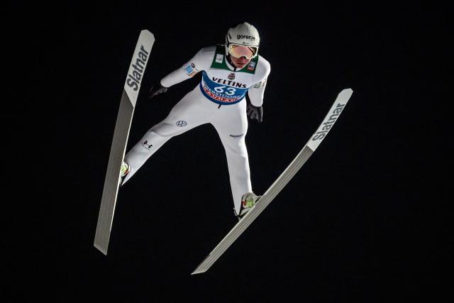 Slovenia's Anze Lanisek competes during the qualifying for the Men's Individual Large Hill HS137 event of the FIS Ski Jumping World Cup, the first leg of the Four Hills Tournament, in Oberstdorf, southern Germany on December 28, 2025. (Photo by Philipp Guelland / AFP)