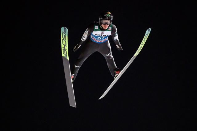 Japan's Ren Nikaido competes during the qualifying for the Men's Individual Large Hill HS137 event of the FIS Ski Jumping World Cup, the first leg of the Four Hills Tournament, in Oberstdorf, southern Germany on December 28, 2025. (Photo by Philipp Guelland / AFP)