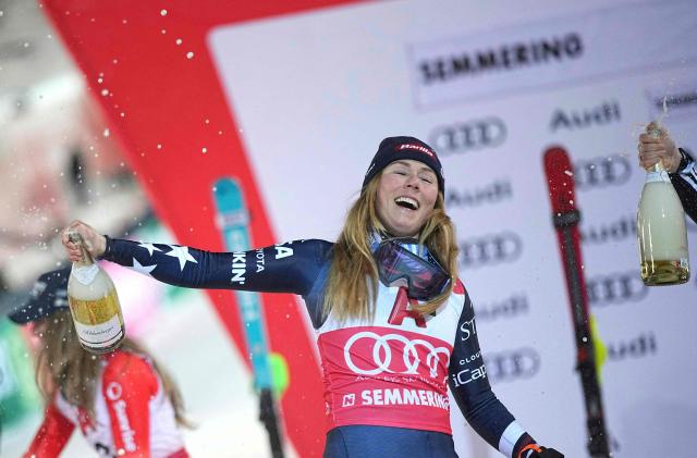 Winner USA's Mikaela Shiffrin celebrates on the podium with sparkling wine after the Women's Slalom race of the FIS Alpine Ski World Cup in Semmering, Austria on December 28, 2025. (Photo by GEORG HOCHMUTH / APA / AFP) / Austria OUT