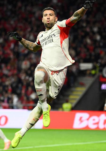 SL Benfica's Argentine defender #30 Nicolas Otamendi celebrates scoring the opening goal during the Portuguese League football match between SC Braga and SL Benfica at Municipal Stadium in Braga on December 28, 2025. (Photo by Miguel RIOPA / AFP)