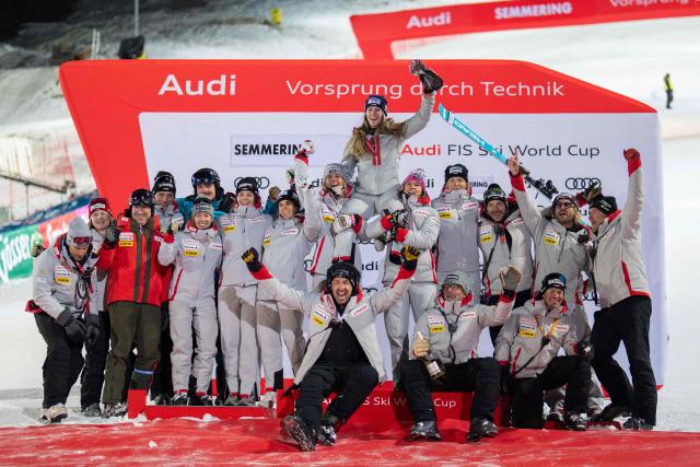 Second placed Switzerland's Camille Rast celebrates with her team after the Women's Slalom race of the FIS Alpine Ski World Cup in Semmering, Austria on December 28, 2025. (Photo by GEORG HOCHMUTH / APA / AFP) / Austria OUT