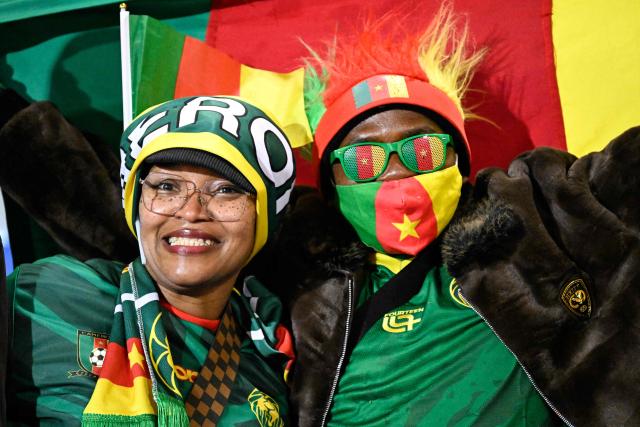 Cameroon supporters pose before the Africa Cup of Nations (CAN) Group F football match between Ivory Coast and Cameroon at Marrakesh Stadium in Marrakesh on December 28, 2025. (Photo by Khaled DESOUKI / AFP)
