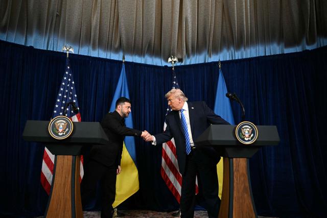 US President Donald Trump and Ukranian President Volodymyr Zelensky shake hands during a press conference following talks at Trump's Mar-a-Lago residence in Palm Beach, Florida, on December 28, 2025. (Photo by Jim WATSON / AFP)