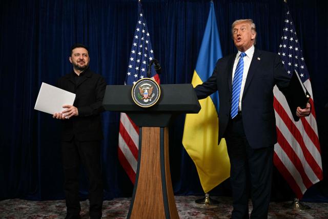US President Donald Trump and Ukranian President Volodymyr Zelensky arrive at a press conference following talks at Trump's Mar-a-Lago residence in Palm Beach, Florida, on December 28, 2025. (Photo by Jim WATSON / AFP)