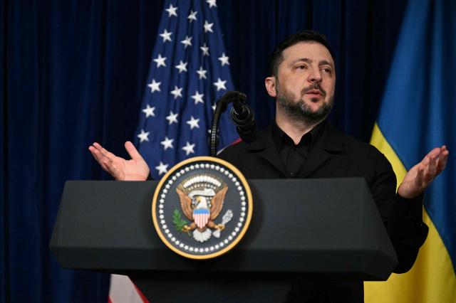Ukranian President Volodymyr Zelensky speaks during a press conference with US President Donald Trump following talks at Trump's Mar-a-Lago residence in Palm Beach, Florida, on December 28, 2025. (Photo by Jim WATSON / AFP)