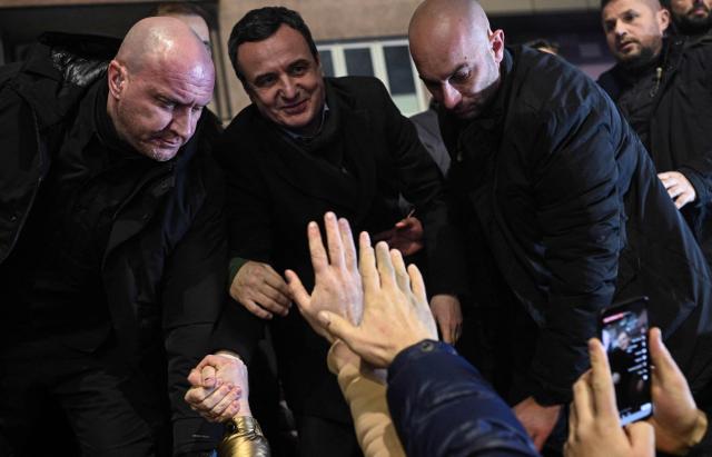 Kosovo’s acting Prime Minister and leader of the Vetevendosje Movement (LVV), Albin Kurti (2L), celebrates election results with supporters in Pristina on December 28, 2025. Preliminary results in Kosovo's parliamentary elections on December 28, suggested that caretaker Prime Minister Albin Kurti's party was nearing 50 percent, potentially ending the country's long-running political deadlock. (Photo by Armend NIMANI / AFP)