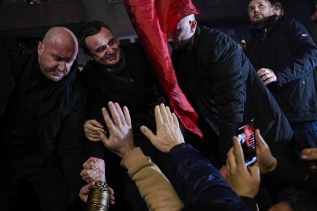 Kosovo’s acting Prime Minister and leader of the Vetevendosje Movement (LVV), Albin Kurti (2L), celebrates election results with supporters in Pristina on December 28, 2025. Preliminary results in Kosovo's parliamentary elections on December 28, suggested that caretaker Prime Minister Albin Kurti's party was nearing 50 percent, potentially ending the country's long-running political deadlock. (Photo by Armend NIMANI / AFP)