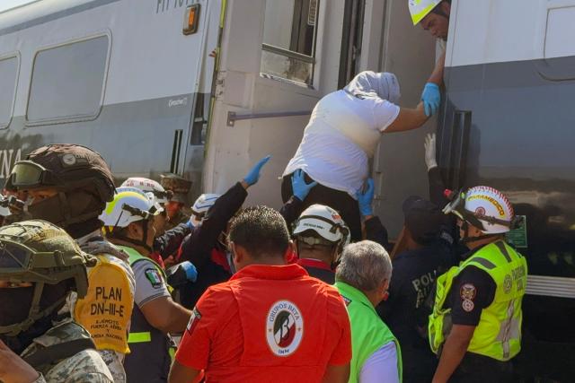 Mexican Army soldiers and Civil Protection members rescued passengers from the Interoceanic train that derailed in the Asuncion Ixtaltepec area on the route to Oaxaca, Mexico on December 28, 2025. A train carrying 241 passengers and nine crew members crashed this Sunday in the southern Mexican state of Oaxaca, the Mexican Navy —which operates that railway line— reported, without yet confirming whether there are any deaths or injuries. (Photo by Rusvel RASGADO / AFP)