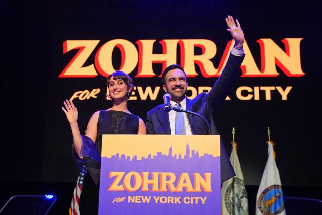 (FILES) New York City Mayoral candidate Zohran Mamdani (R) celebrates alongside his wife Rama Duwaji (L) during an election night event at the Brooklyn Paramount Theater in Brooklyn, New York on November 4, 2025. New York mayor-elect Zohran Mamdani is set to become the US city's first Muslim mayor, and the youthful optimism of his Democratic Socialist platform will be put to the test as he takes office on January 1st for a four-year term that faces high expectations. (Photo by Angelina Katsanis / AFP)