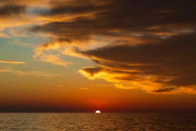 This photograph taken on December 29, 2025 shows the sunrise over the Mediterranean Sea. (Photo by Sameer Al-DOUMY / AFP)