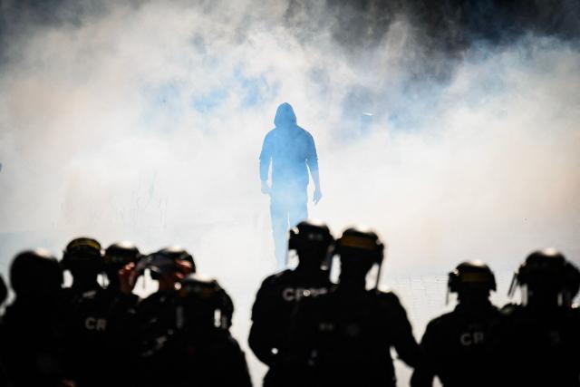 AFP PICTURES OF THE YEAR 2025

A protester walks amid the smoke of tear gas thrown by an anti-riot police officers during demonstration in Nantes, western France, on September 18, 2025, part of a day of nationwide strikes and protests called by unions over France's national budget.. France is bracing for a day of nationwide protests on September 18, 2025, with a source close to the authorities saying some 800,000 people are expected to take to the streets. In a rare show of unity, trade unions have urged French people to strike in protest at the authorities' "horror show" draft budget designed to reduce France's ballooning debt. (Photo by Loic VENANCE / AFP) / AFP PICTURES OF THE YEAR 2025