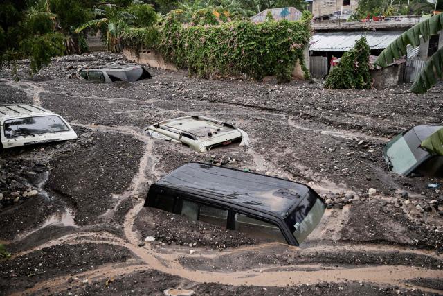 AFP PICTURES OF THE YEAR 2025

Cars are submerged in mud following Hurricane Melissa in Petit-Goave, 68km southwest of Port-au-Prince, on October 30, 2025.. Hurricane Melissa was moving towards Bermuda on Thursday after ripping a path of destruction through the Caribbean that left at least 20 people dead in Haiti, and parts of Jamaica and Cuba in ruins. (Photo by Clarens SIFFROY / AFP) / AFP PICTURES OF THE YEAR 2025