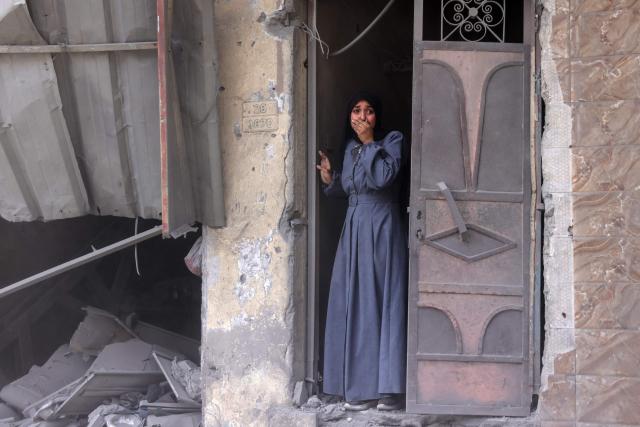 AFP PICTURES OF THE YEAR 2025

A Palestinian woman standing in a doorway reacts as she watches the aftermath of an Israeli strike that hit Gaza City's southern al-Zeitoun neighbourhood on August 8, 2025.. Israel's military will "take control" of Gaza City under a new plan approved by Prime Minister Benjamin Netanyahu's security cabinet, touching off a wave of criticism Friday from both inside and outside the country. (Photo by BASHAR TALEB / AFP) / AFP PICTURES OF THE YEAR 2025