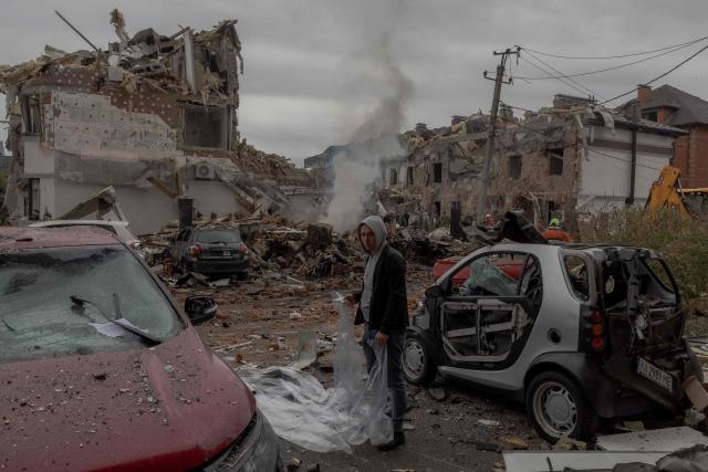 AFP PICTURES OF THE YEAR 2025

A man prepares to cover a damaged car with a plastic sheet at the site of heavily damaged residential buildings following a Russian air attack on the outskirts of Kyiv, on September 28, 2025, amid the Russian invasion of Ukraine.. An overnight Russian barrage on Kyiv killed at least four people, including a 12-year-old girl, Ukrainian authorities said on September 28, 2025. (Photo by Roman PILIPEY / AFP) / AFP PICTURES OF THE YEAR 2025